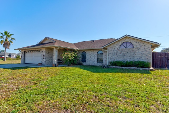 ranch-style house featuring a front lawn, fence, concrete driveway, a garage, and brick siding