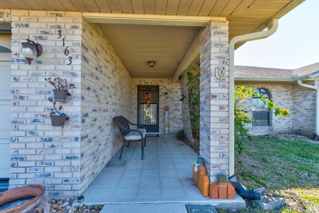 entrance to property with brick siding