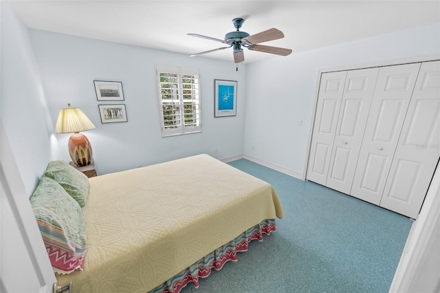 bedroom with a closet, ceiling fan, and baseboards