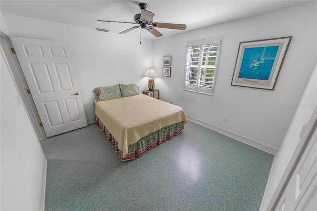 bedroom featuring baseboards, visible vents, and a ceiling fan