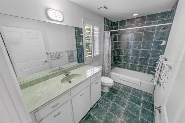 bathroom with shower / bath combo, visible vents, vanity, and toilet