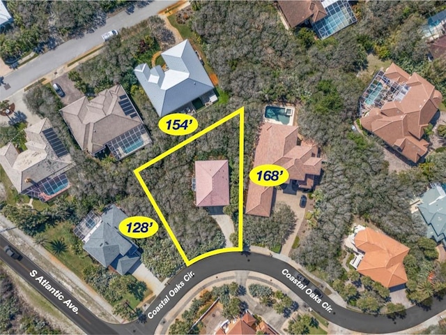 birds eye view of property with a residential view