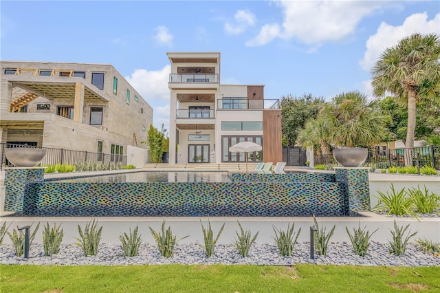 view of pool featuring fence