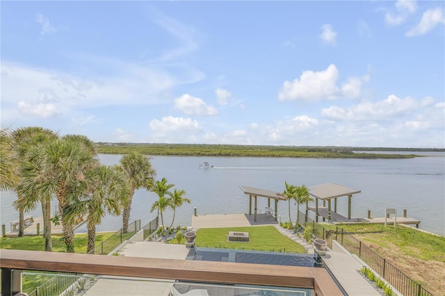 view of water feature with a dock and boat lift