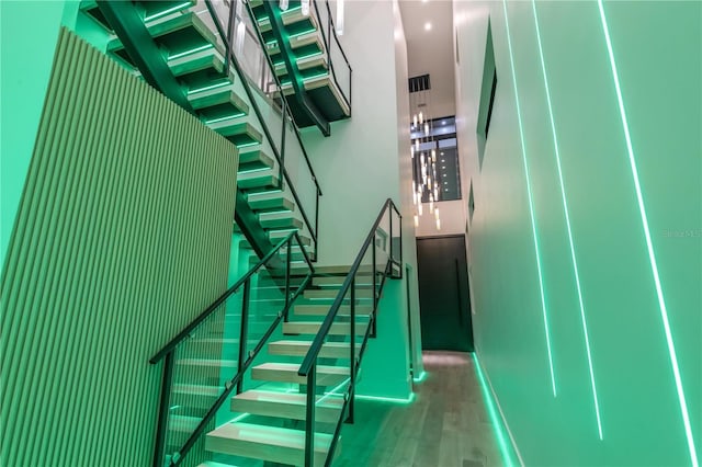 staircase featuring wood finished floors