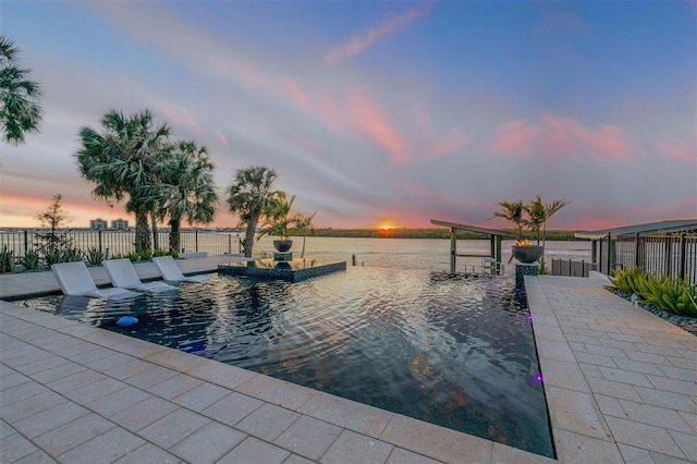view of swimming pool with fence
