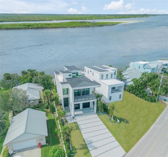 aerial perspective of suburban area with a large body of water