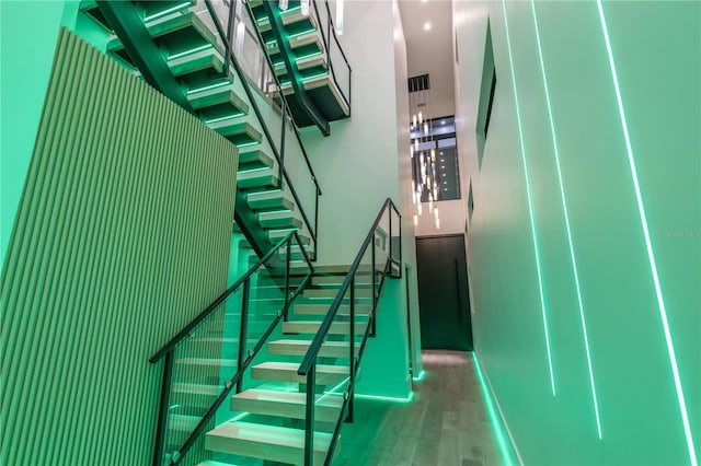 staircase with wood finished floors
