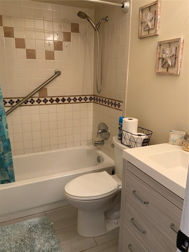 bathroom with toilet, tile patterned floors, shower / bath combo with shower curtain, and vanity