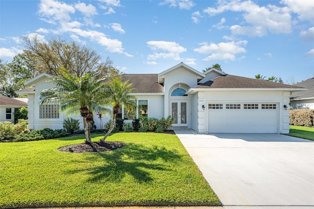 single story home with french doors, driveway, a front lawn, and stucco siding