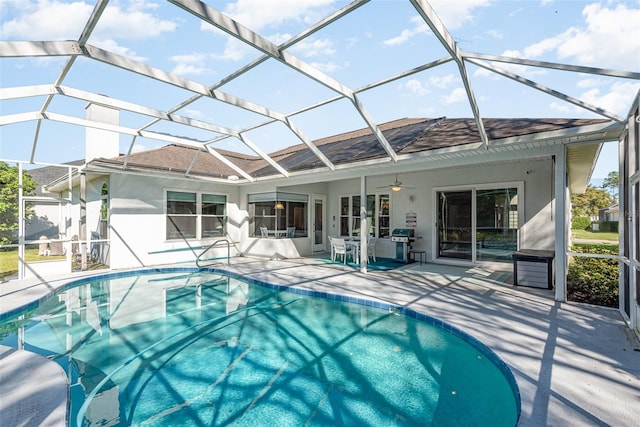 pool featuring a ceiling fan, a lanai, and a patio area