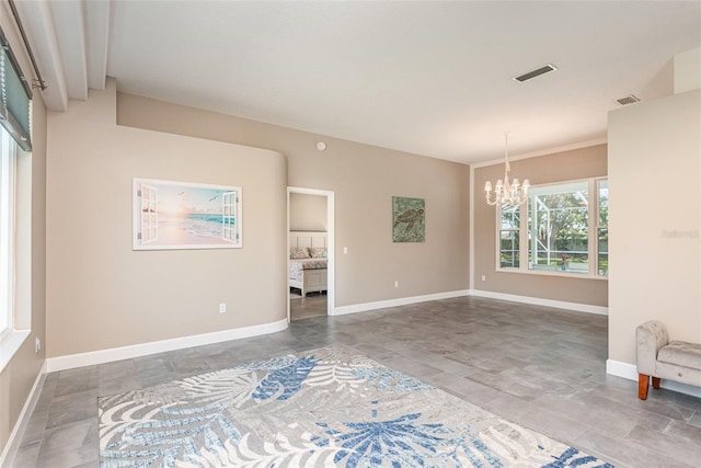 unfurnished room with baseboards and a chandelier