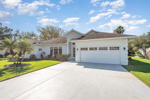 ranch-style home with a front yard, an attached garage, driveway, and stucco siding