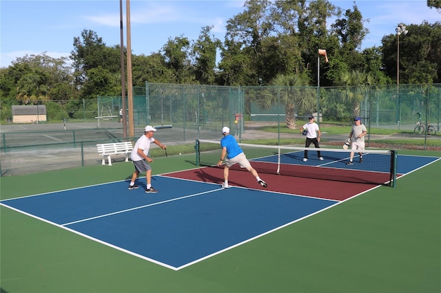 view of sport court with community basketball court and fence