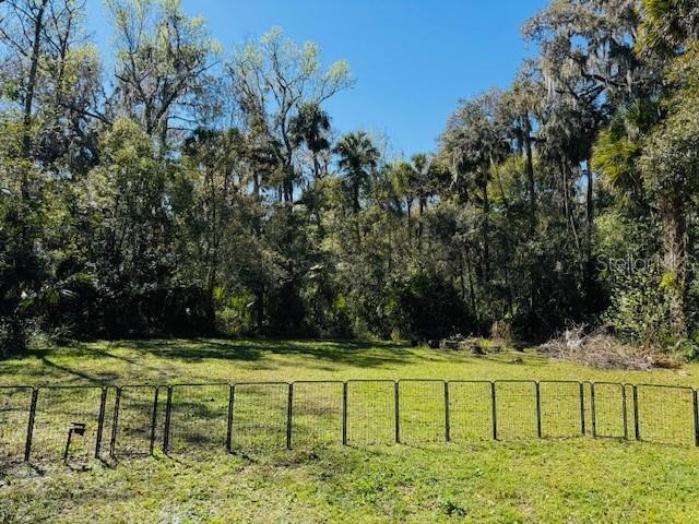 view of yard featuring a gate and fence