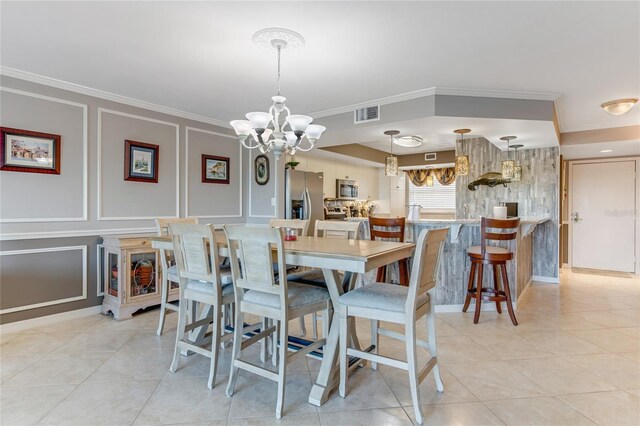 533 Marina Point Dr Unit 533, Daytona Beach, FL 32114 - dining area with an inviting chandelier, light tile patterned floors, crown molding, visible vents, and a decorative wall