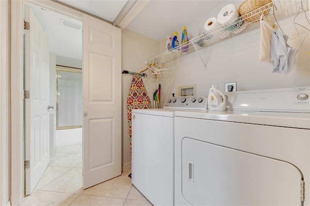 533 Marina Point Dr Unit 533, Daytona Beach, FL 32114 - washroom with visible vents, laundry area, washing machine and clothes dryer, and light tile patterned flooring