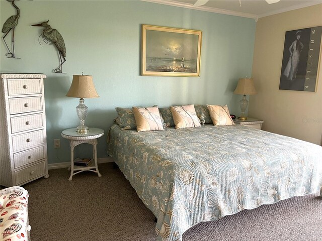 carpeted bedroom with baseboards and crown molding