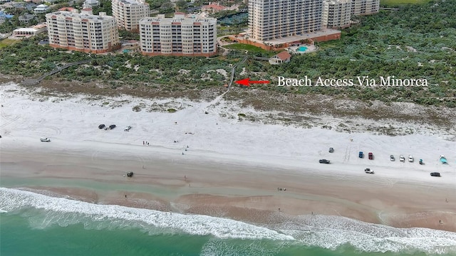 aerial view featuring a view of city, a view of the beach, and a water view