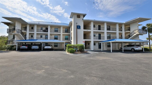 view of property with covered parking