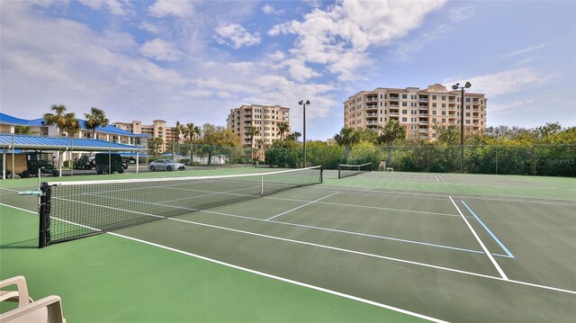 view of sport court featuring fence