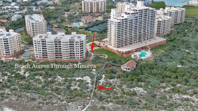 2700 N Peninsula Ave Unit 113, New Smyrna Beach, FL 32169 - aerial view of a pool area and a nearby body of water