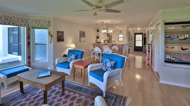 2700 N Peninsula Ave Unit 113, New Smyrna Beach, FL 32169 - living area featuring ornamental molding, ceiling fan, light wood-style floors, baseboards, and a chandelier