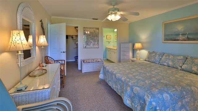 2700 N Peninsula Ave Unit 113, New Smyrna Beach, FL 32169 - bedroom featuring carpet flooring, a walk in closet, ornamental molding, ensuite bath, and a closet