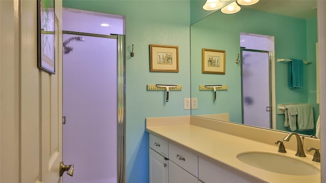 2700 N Peninsula Ave Unit 113, New Smyrna Beach, FL 32169 - bathroom featuring vanity and a shower stall