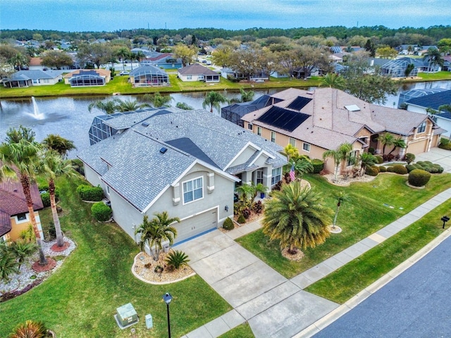 birds eye view of property featuring a residential view and a water view