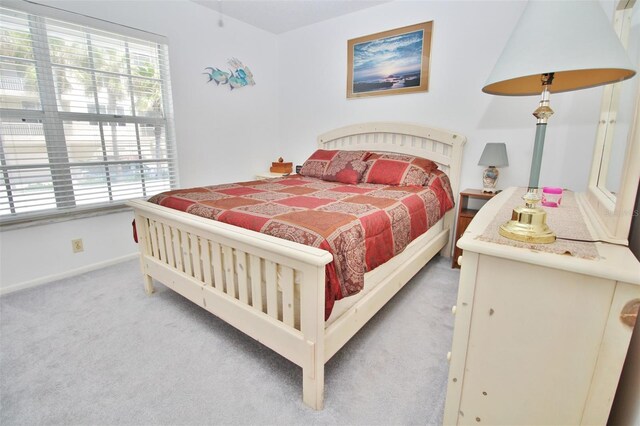 carpeted bedroom with baseboards