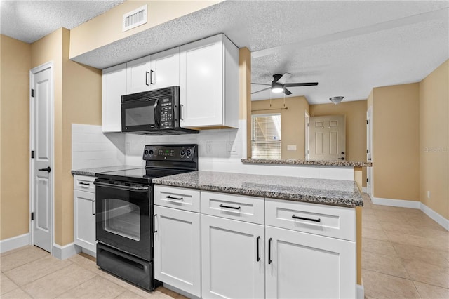 kitchen featuring visible vents, black appliances, tasteful backsplash, a peninsula, and white cabinets