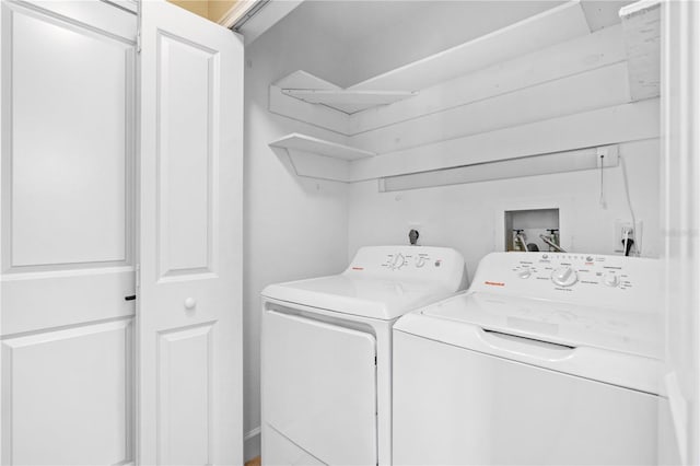 laundry room featuring washer and dryer and laundry area