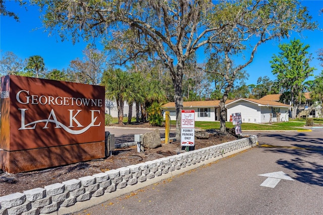 community / neighborhood sign with driveway