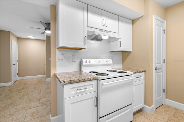 kitchen featuring under cabinet range hood, electric range, white cabinets, and decorative backsplash