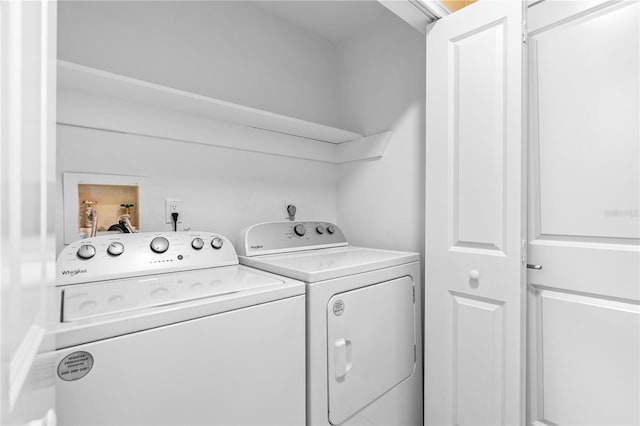 clothes washing area with laundry area and separate washer and dryer