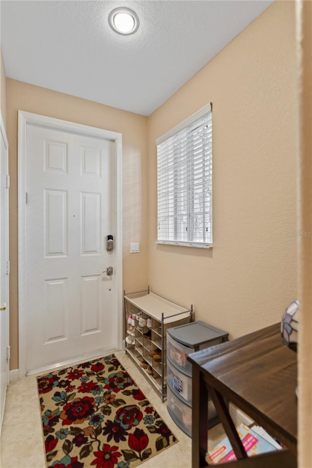 foyer featuring a textured ceiling