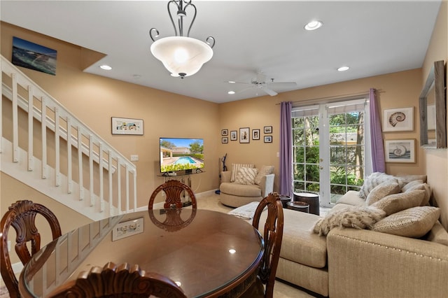 dining area featuring recessed lighting, baseboards, ceiling fan, and stairs