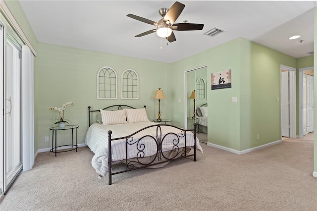 carpeted bedroom with baseboards, visible vents, and ceiling fan