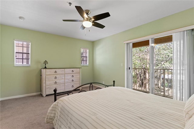 carpeted bedroom featuring ceiling fan, baseboards, and access to outside