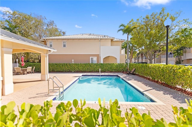 pool featuring a patio area