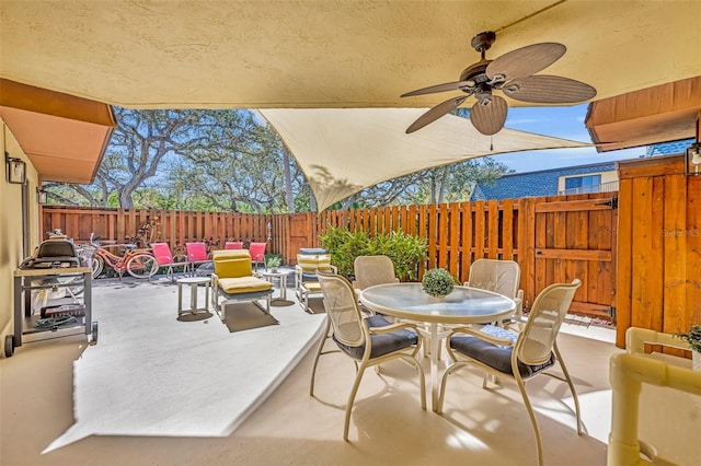 135 Cedar Dunes Dr, New Smyrna Beach, FL 32169 - view of patio featuring outdoor dining area, ceiling fan, and fence