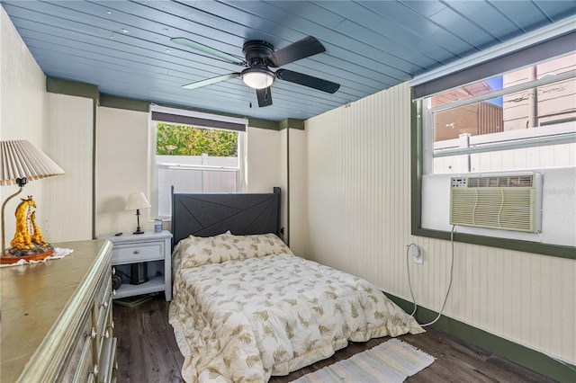 bedroom featuring dark wood finished floors, cooling unit, wood ceiling, and ceiling fan