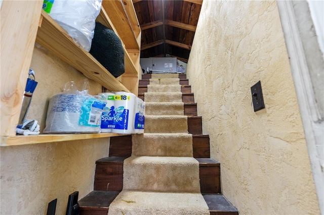 stairway with a textured wall