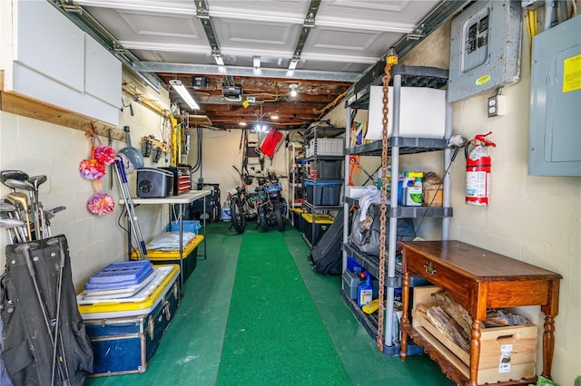 garage featuring concrete block wall and electric panel