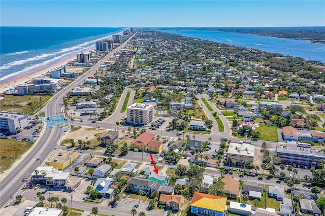 bird's eye view featuring a water view and a view of the beach