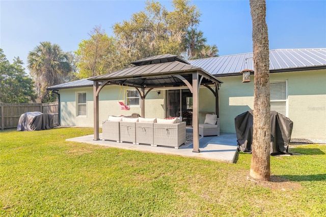 rear view of property with a patio area, fence, a lawn, and an outdoor hangout area