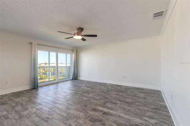 unfurnished room with visible vents, dark wood-style flooring, and crown molding