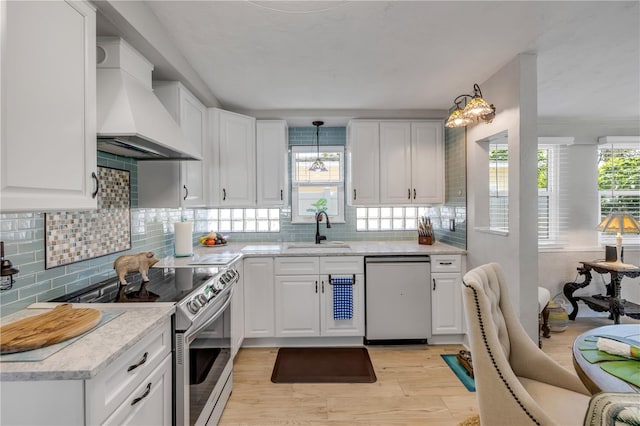 kitchen with custom range hood, dishwashing machine, stainless steel range with electric stovetop, white cabinetry, and a sink