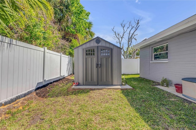 view of shed featuring a fenced backyard